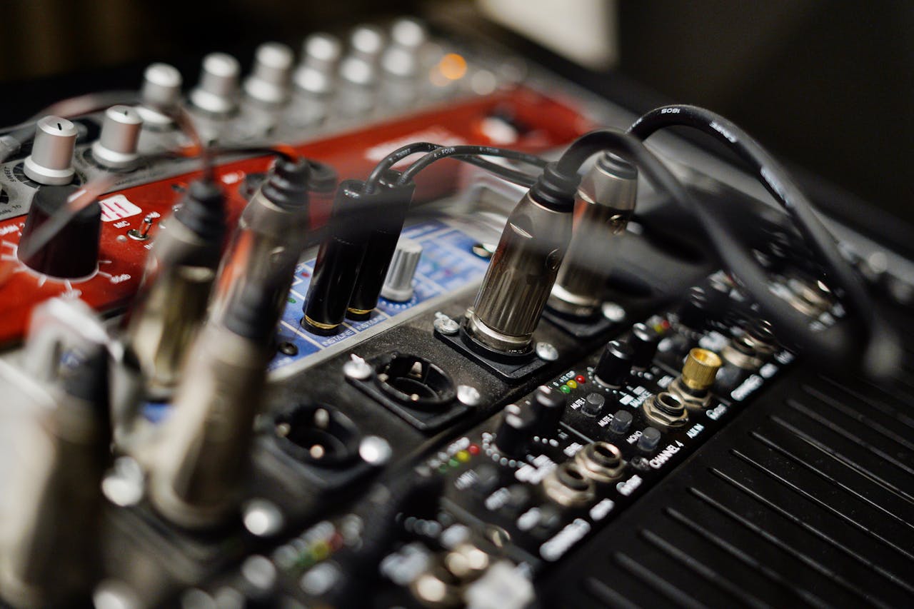 creative Detailed view of audio equipment with cables and sound card connections in a studio setting.